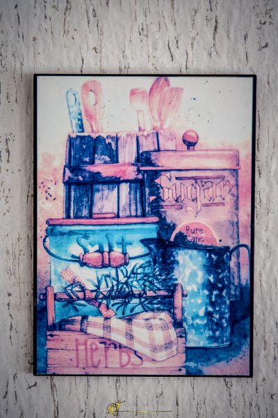 Ein Gemälde an der Wand mit einer Pflanze darin